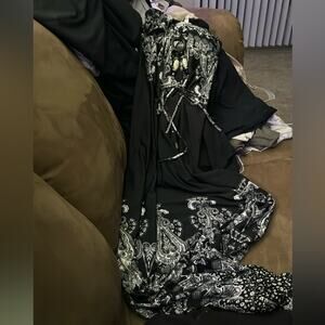 Elegant Black Dress with White Paisley Pattern